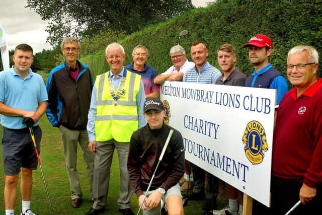 Melton Lions President Conroy Godber greets golfers at the first tee EMN-180822-100020002