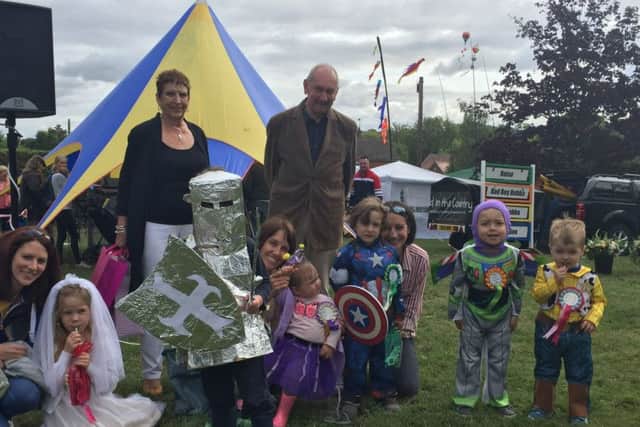 Winning knight Joshua Nicholson with children who entered the fancy dress competition PHOTO: Jim Patman