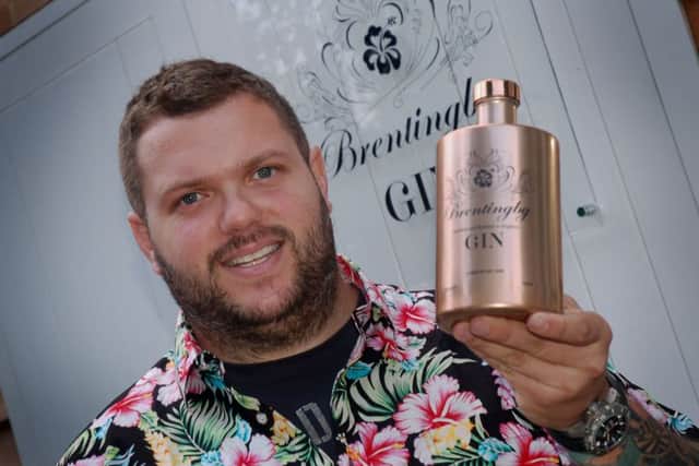 Bruce Midgley with a bottle of gin produced at his new Brentingby Gin distillery EMN-180827-165850001