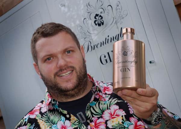 Bruce Midgley with a bottle of gin produced at his new Brentingby Gin distillery EMN-180827-165850001
