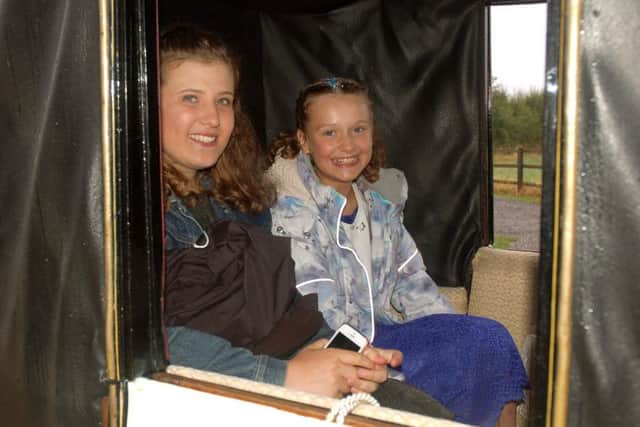 Grace Moore (right) and friend Ruby Kendle  travel in the horse and carriage en route to Grace's special party EMN-180827-113033001