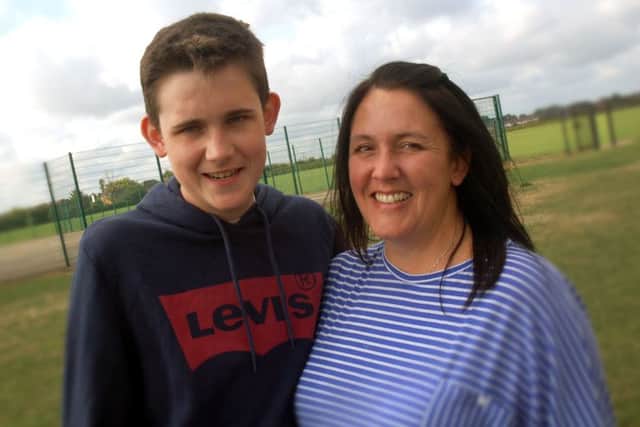 Charlie Ross is congratulated by mum Amanda on GCSE results day at John Ferneley College EMN-180828-092919001