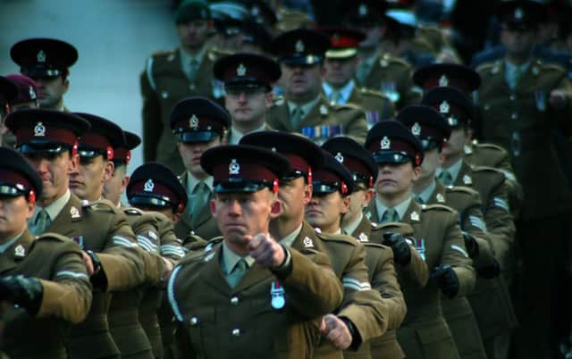 Service personnel from the Defence Animal Centre (DAC) march to the Memorial Gardens EMN-180829-125950001