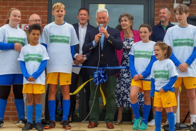 MP Alan Duncan and Mayor of Melton Pru Chandler prepare to cut the ribbon EMN-180828-180847002