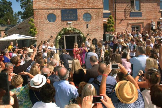 Crowds gather for the official opening of The Engine Yard retail park at Belvoir Castle EMN-180309-115257001