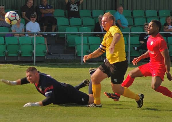 Reeve lobs Melton in front for his fourth goal of the season EMN-180309-122724002