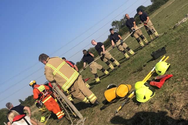 Firefighters prepare to haul Milly from the River Wreake after the horse slipped into the water from her field at Frisby EMN-180409-100909001