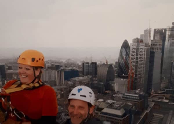 Helen Gardner heroically abseils down Broadgate Tower in London to raise money for a hospital which has cared for her partner EMN-180409-114424001