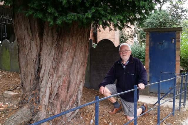 John Craig next to the yew tree, which has a protection order on it, and in front of the old boiler house, which both have to be removed to make way for a new building at St Mary's Church in Melton EMN-180409-150929001