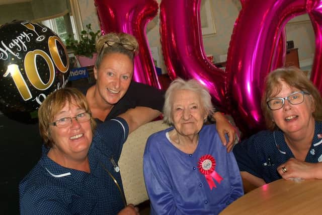Mary Williamson celebrates her 100th birthday with staff at Egerton Lodge Residential Home in Melton, Julie Croft, Tracey Freer and Heather Clifford EMN-180509-104929001