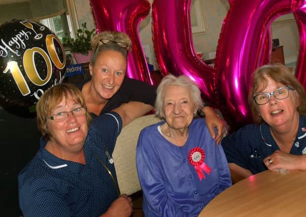 Mary Williamson celebrates her 100th birthday with staff at Egerton Lodge Residential Home in Melton, Julie Croft, Tracey Freer and Heather Clifford EMN-180509-104929001