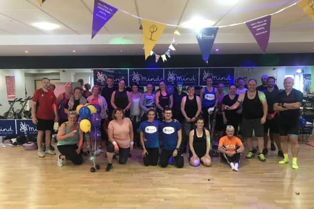 Exhausted but happy gym members who took to the saddle for charity PHOTO: Supplied