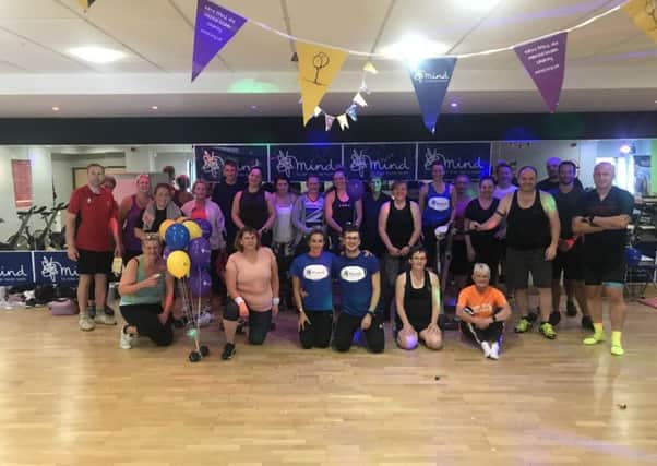 Exhausted but happy gym members who took to the saddle for charity PHOTO: Supplied