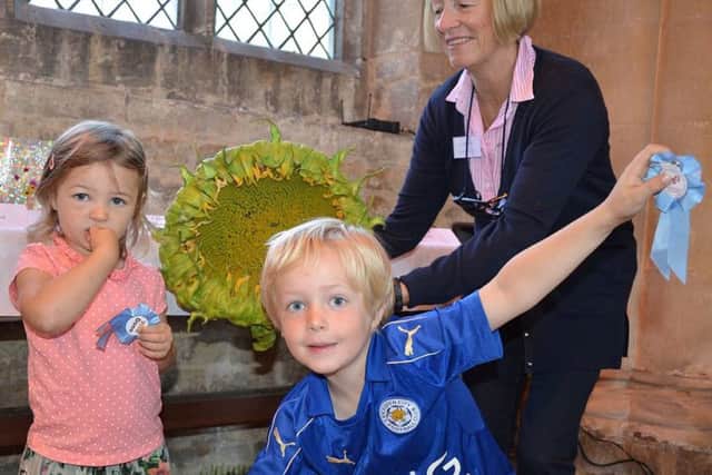 Show official Sarah Bysouth with two young exhibitors at the Whissendine Craft and Produce Show PHOTO: Supplied