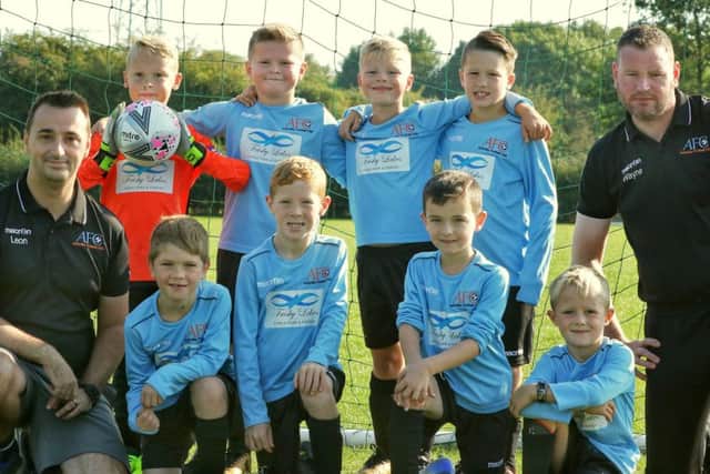 Cobras Under 8s with coach Leon Elford (left) and assistant coach Wayne Pymm EMN-180609-143448002