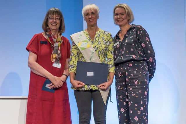 Denise Geach (centre), of Melton, wins The 1718 Challenge at the Festival of Quilts, pictured with guild president Linda Bilsborrow (left) and festival event director Anna Baptiste EMN-180509-150932001