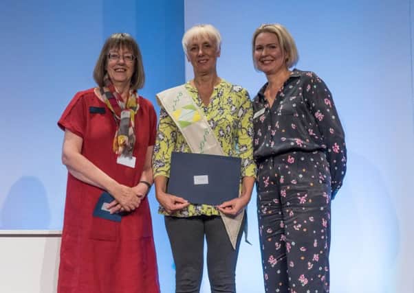 Denise Geach (centre), of Melton, wins The 1718 Challenge at the Festival of Quilts, pictured with guild president Linda Bilsborrow (left) and festival event director Anna Baptiste EMN-180509-150932001