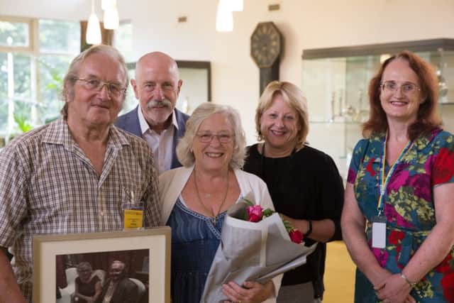 Norm and Tricia Marsland (front), who have retired from fostering aftr 48 years, with Paul Meredith and Sharon Cooke, County Hall's director and assistant director of children's social sare, and their supporting social worker, Veronica EMN-180709-121013001