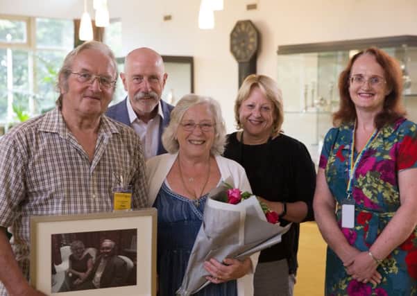 Norm and Tricia Marsland (front), who have retired from fostering aftr 48 years, with Paul Meredith and Sharon Cooke, County Hall's director and assistant director of children's social sare, and their supporting social worker, Veronica EMN-180709-121013001
