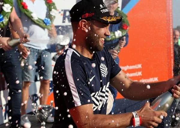 Mike Comber enjoys his champagne moment EMN-180709-112142002