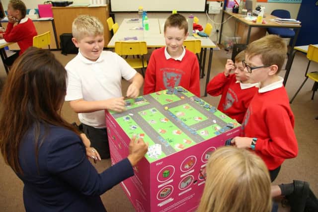Pupils at Brownlow Primary School, in Melton, try out a new interactive learning resource about broadband internet EMN-180709-125437001