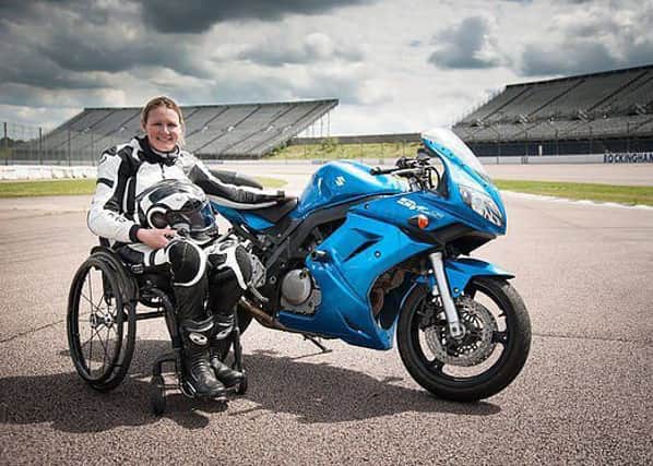 Claire Lomas poses with a motorcycle during one of her track race practice sessions.
PHOTO DAVE HUGHES EMN-180909-152118001