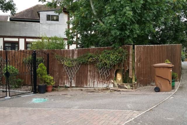 The damage to the gates, the fence and the bin at the property in Gartree Court, Melton, after a car crashed into them and ended up on its side EMN-181009-133832001