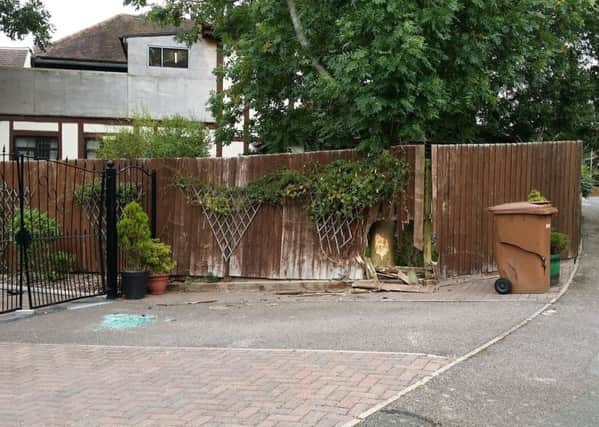 The damage to the gates, the fence and the bin at the property in Gartree Court, Melton, after a car crashed into them and ended up on its side EMN-181009-133832001