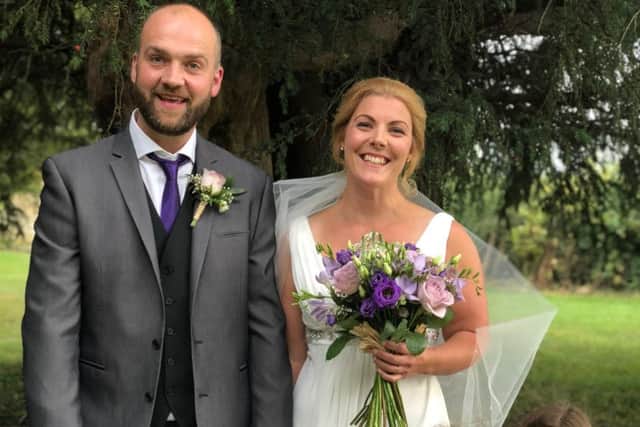 Alexandra North and husband Adam Wright on their wedding day at Barkestone with their three children EMN-181109-115042001