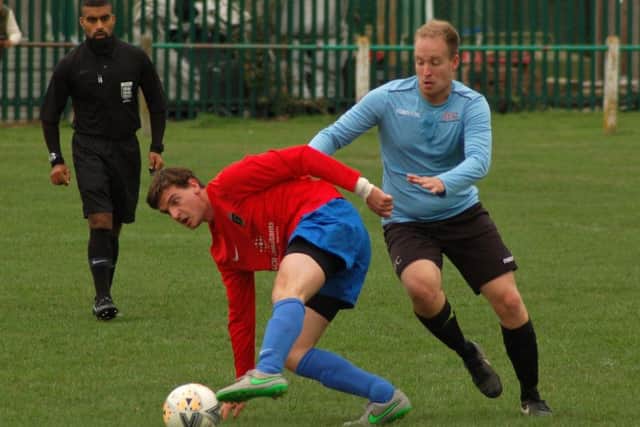 Ben Lapworth battles for possession as Asfordby clashed with Hathern EMN-180919-094438002