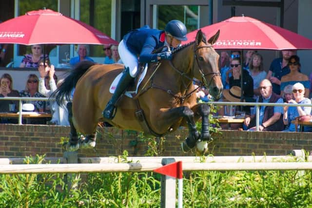 Holly Smith in action at Hickstead this summer with another stable star Quality Old Joker EMN-180919-133219002