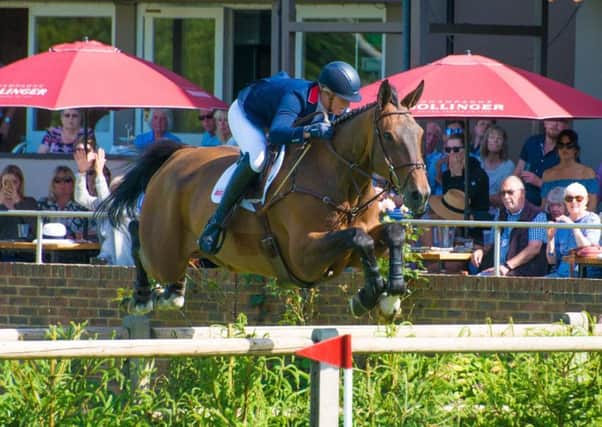 Holly Smith in action at Hickstead this summer with another stable star Quality Old Joker EMN-180919-133219002