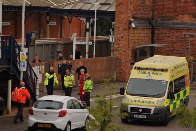The emergency services at Melton Railway Station after reports of a man jumping from the railway bridge on Burton Street EMN-180924-112013001