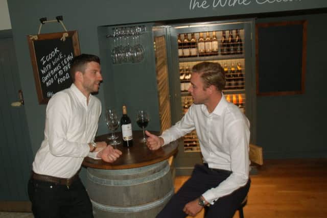 England cricketer Stuart Broad right) chats with Notts CCC team-mate Harry Gurney at The Wine Cellar at their new pub - the Tap and Run at Upper Broughton EMN-180924-144918001