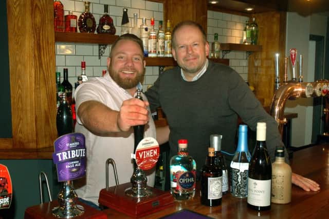 Manager Tim Howard (left) and director Dan Cramp behind the bar at the refurbished Tap and Run at Upper Broughton EMN-180924-144939001