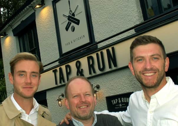 England cricketer Stuart Broad (left) with Notts CCC team-mate Harry Gurney (right) and director Dan Cramp outside their new pub - the Tap and Run at Upper Broughton EMN-180924-145011001