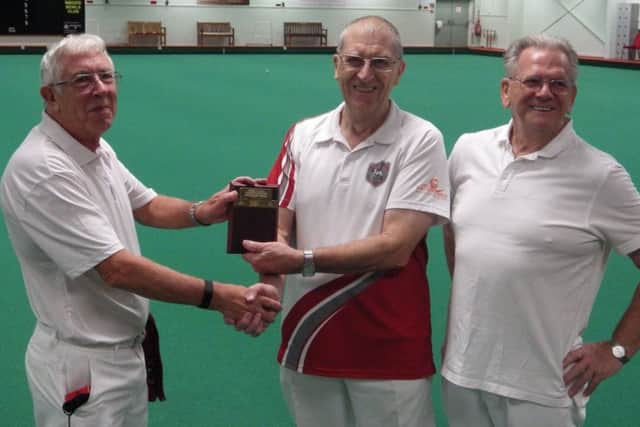 Melton Indoor Bowls Club competition secretary Mick Rawle (left) with Novice Mens Singles Shield winner David Pick, and runner-up Brian Mitchell (right) EMN-180925-154204002
