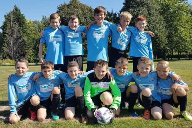 Asfordby FC U11 Swifts before their first game of the season. From left, back - Harry Sim, Thomas Pead, Will Newbold, Josh Hatherley, Jake Scoffield; front - Liam Round, Dan Sharpe, Charlie Wyles, Alfie Haines-Bass, Josh Taylor, Mack Ninnis, Isaac Potts EMN-180925-163714002