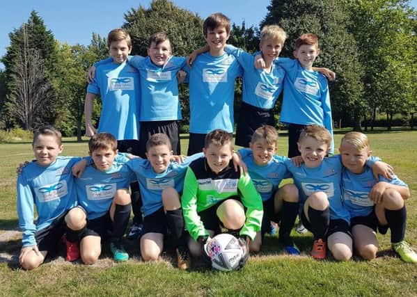 Asfordby FC U11 Swifts before their first game of the season. From left, back - Harry Sim, Thomas Pead, Will Newbold, Josh Hatherley, Jake Scoffield; front - Liam Round, Dan Sharpe, Charlie Wyles, Alfie Haines-Bass, Josh Taylor, Mack Ninnis, Isaac Potts EMN-180925-163714002