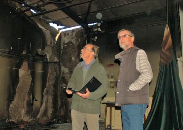 Chairman Brian Keevil and treasurer Ian Smith inspect the fire damage at Hose village hall EMN-180110-111002001