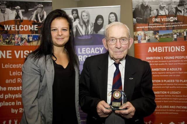 Harold Veazey, pictured when he was 96, receiving an award for being the oldest Leicestershire athlete from Natasha Hughes, customer relationships manager at imago EMN-180210-101142001