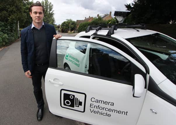 Councillor Blake Pain with the camera enforcement vehicle being used by Leicestershire County Council to clamp down on motorists who park irresponsibly outside schools EMN-180210-131433001