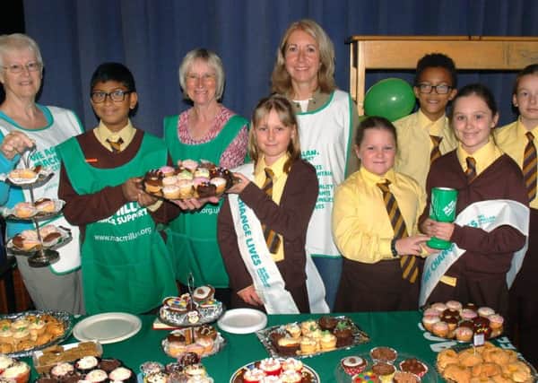 St Francis pupils with Macmillan volunteers get ready for action PHOTO: Tim Williams