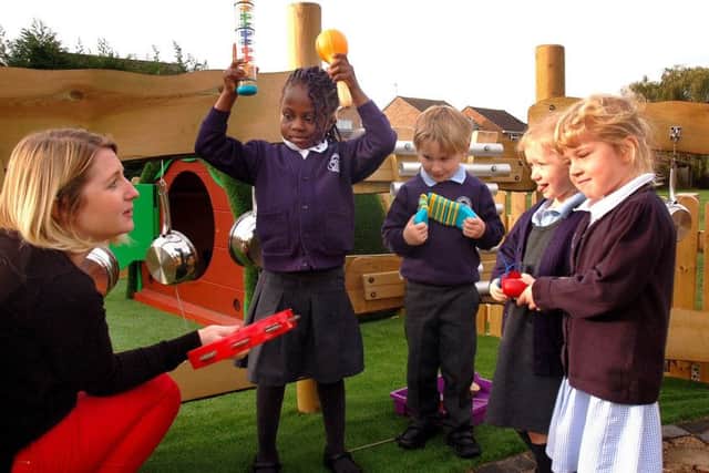 F2 teacher Hannah Taylor and pupils in the sensory garden at Swallowdale Primary School's new ?30,000 outdoor learning centre EMN-181210-103611001