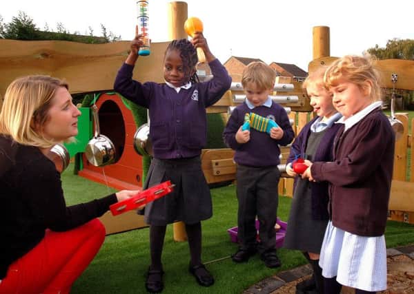 F2 teacher Hannah Taylor and pupils in the sensory garden at Swallowdale Primary School's new ?30,000 outdoor learning centre EMN-181210-103611001