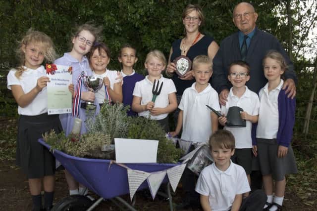 Ab Kettleby Primary School who won Gold Cup with their teacher Anna Fryer and Brian Hodder, chairman of Melton in Bloom PHOTO: Supplied