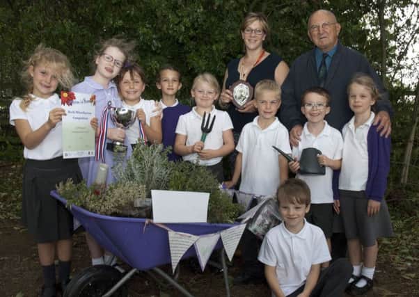 Ab Kettleby Primary School who won Gold Cup with their teacher Anna Fryer and Brian Hodder, chairman of Melton in Bloom PHOTO: Supplied