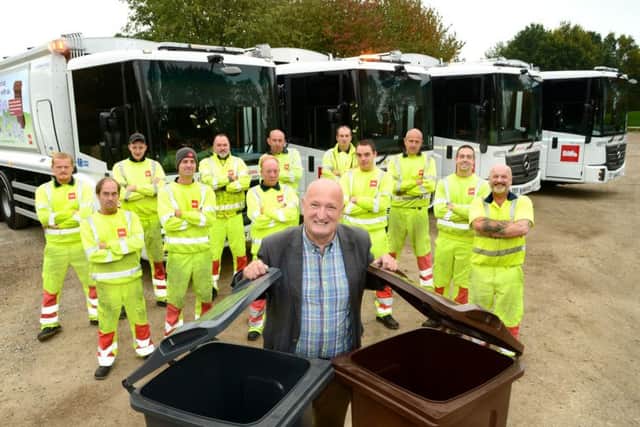 Melton Council leader, Councillor Joe Orson, with the authority's new refuse lorries EMN-181210-152255001