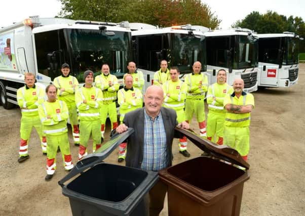 Melton Council leader, Councillor Joe Orson, with the authority's new refuse lorries EMN-181210-152255001