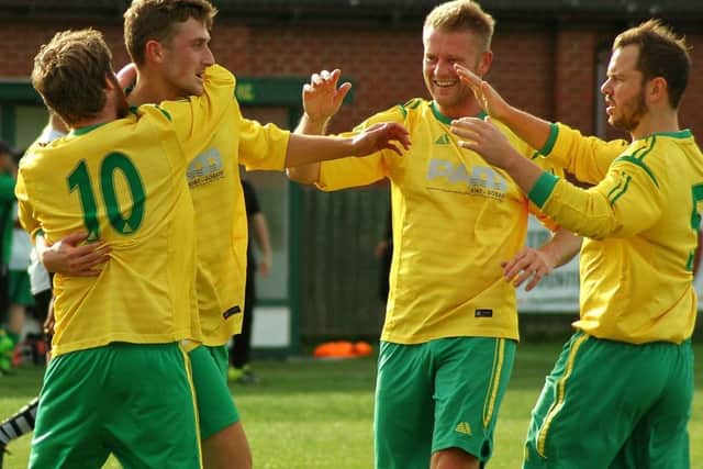 David Hazeldine and Aaron Ridout congratulate goalscorer Dunlop EMN-181016-095724002